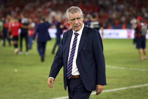 CORRECTS SLUG TO POLAND SANTOS; FILE - Poland's head coach Fernando Santos walks on the pitch after the Euro 2024 group E qualifying soccer match between Albania and Poland in Tirana, Albania, Sunday, Sept. 10, 2023. Fernando Santos' position as Poland coach remained uncertain Tuesday after he met with the president of the country's soccer federation following the team's poor start to European Championship qualifying. (AP Photo/Franc Zhurda, File)