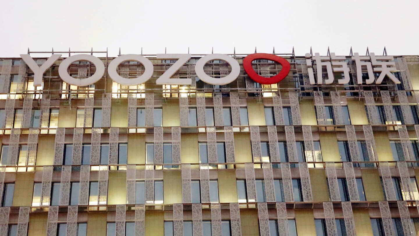 FILE - The Yoozoo logo is displayed at the Yoozoo group headquarters in Shanghai on Dec. 8, 2020. A former executive at Yoozoo Games was sentenced to 