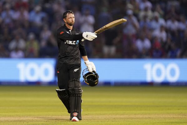 New Zealand's Devon Conway celebrates reaching his century during the first one day international match between England and New Zealand in Cardiff, Wales, Friday Sept. 8, 2023. (Joe Giddens/PA via AP)