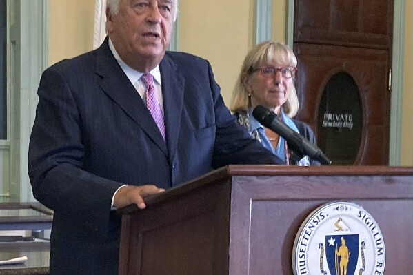 FILE - Massachusetts House Speaker Ronald Mariano and fellow Democratic Senate President Karen Spilka speak at an event at the Massachusetts Statehouse in Boston, Sept. 26, 2023. Massachusetts House leaders unveiled a proposed $57.9 billion state budget for the 2025 fiscal year that would include $500 million for the state’s emergency shelter system and what lawmakers say is a record investment of $555 million for the beleaguered Massachusetts Bay Transportation Authority. (AP Photo/Steve LeBlanc, File)