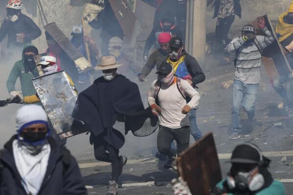 Demonstrators clash with police during protests against President Guillermo Lasso's economic policies and a demand to cut fuel prices, in downtown Quito, Ecuador, Thursday, June 23, 2022. (AP Photo/Dolores Ochoa)