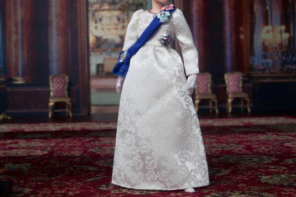 This undated photo provided by Mattel shows Mattel's new Queen Elizabeth II Barbie doll. Britain's Queen Elizabeth II was marking her 96th birthday privately Thursday, April 21, 2022, retreating to the Sandringham estate in eastern England, a refuge from the affairs of state. This birthday comes during the queen’s platinum jubilee year, marking her 70 years on the throne. While Thursday will be low-key, public celebrations will take place June 2-5, when four days of jubilee festivities have been scheduled to coincide with the monarch’s official birthday. (Mattel via AP)