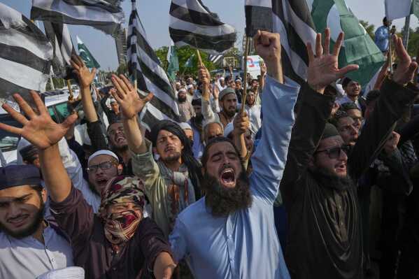 Supporters of a religious party 'Jamiat Ulema-e-Islam-F' chant anti-India slogans during a demonstration to condemn Indian strikes in Pakistan and to show their support with Pakistan military, in Islamabad, Pakistan, Friday, May 9, 2025. (AP Photo/Anjum Naveed)