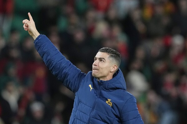 Portugal's Cristiano Ronaldo gestures to the crowd after winning the UEFA Nations League soccer match between Portugal and Denmark, at the Jose Alvalade Stadium in Lisbon, March 23, 2025. (AP Photo/Armando Franca, File)