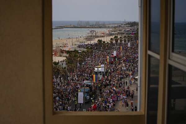 People participate in the annual Pride Parade in Tel Aviv, Israel, Thursday, June 8, 2023. (AP Photo/Ariel Schalit)