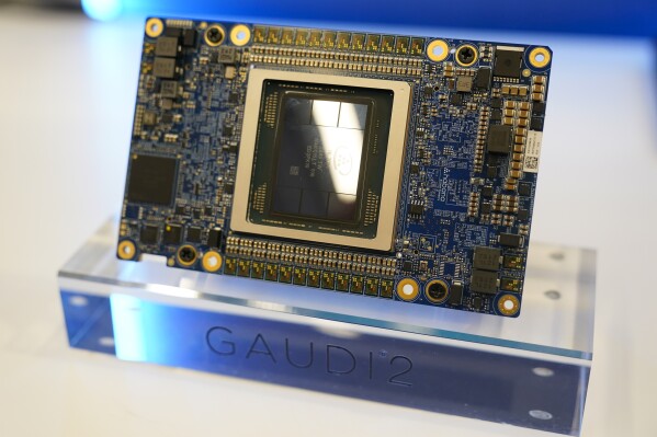 An Intel chip is displayed during an event called AI Everywhere in New York, Thursday, Dec. 14, 2023. Intel is introducing new products that are designed to be used with AI powered computers and applications. (AP Photo/Seth Wenig, File)
