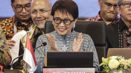 Indonesian Foreign Minister Retno Marsudi applauds during the opening of the Meeting of the Southeast Asia Nuclear Weapon Free Zone Commission at the Association of Southeast Asian Nations (ASEAN) Foreign Minister's Meeting in Jakarta, Indonesia, Tuesday, July 11, 2023. (Adi Weda/Pool Photo via AP)
