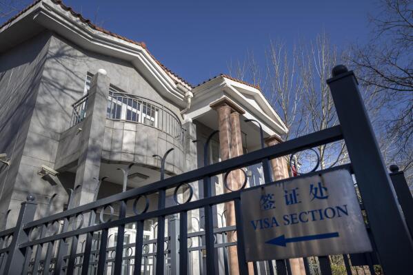 FILE - The Lithuanian Embassy is seen in Beijing, on Dec. 16, 2021. More countries have asked this week to join talks about the European Union’s complaint with the World Trade Organization accusing China of exerting economic pressure on Lithuania. Canada was the latest Thursday, Feb. 10, 2022 saying it wanted to take part in WTO consultations over a dispute tied to Taiwan opening a diplomatic office in the EU member country. (AP Photo/Mark Schiefelbein)