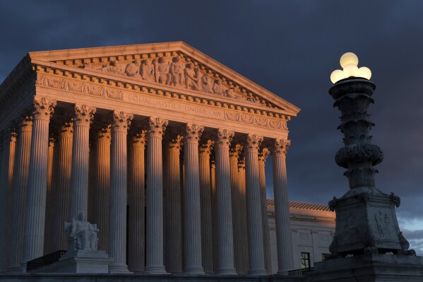 FILE - The Supreme Court is seen at sunset in Washington, on Jan. 24, 2019. On the left and right, Supreme Court justices seem to agree on a basic truth about the American system of government: No one is above the law, not even the president. (AP Photo/J. Scott Applewhite)