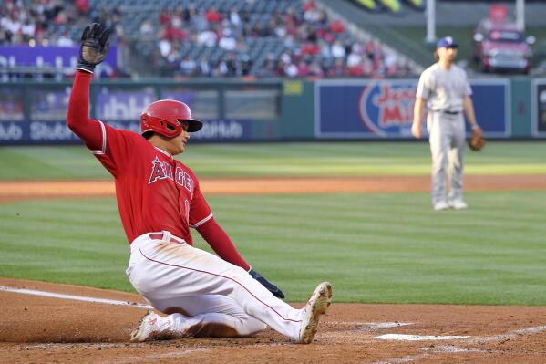 ICYMI: Texas Rangers right fielder Kole Calhoun humorously tries to prevent  reigning MVP Shohei Ohtani from reaching the dugout