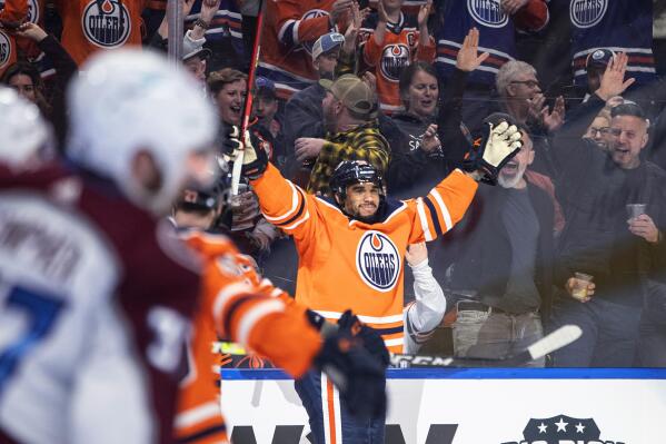 Edmonton Oilers' Evander Kane (91) celebrates a goal against the Colorado Avalanche during the second period of an NHL hockey game in Edmonton, Alberta, Friday, April 22, 2022. (Jason Franson/The Canadian Press via AP)