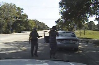 FILE - In this July 10, 2015, file frame from dashcam video provided by the Texas Department of Public Safety, Trooper Brian Encinia arrests Sandra Bland after she became combative during a routine traffic stop in Waller County, Texas. Texas authorities are expected to face sharp questioning over why cellphone video Sandra Bland took during her confrontational 2015 traffic stop never publicly surfaced until May 2019. (Texas Department of Public Safety via AP, File)