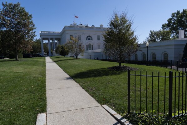 An American flag flies over the White House, Monday, Oct. 5, 2020, in Washington. (AP Photo/Alex Brandon)