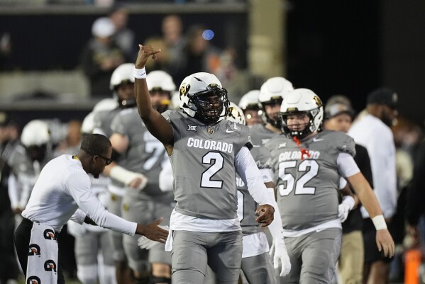 Colorado quarterback Shedeur Sanders (2) warms up before an NCAA college football game Saturday, Oct. 26, 2024, in Boulder, Colo. AP Photo/David Zalubowski, File)