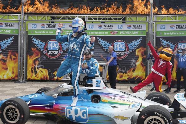 Josef Newgarden (2) celebrates after winning the IndyCar auto race at Texas Motor Speedway in Fort Worth, Texas, Sunday, April 2, 2023. (AP Photo/LM Otero)
