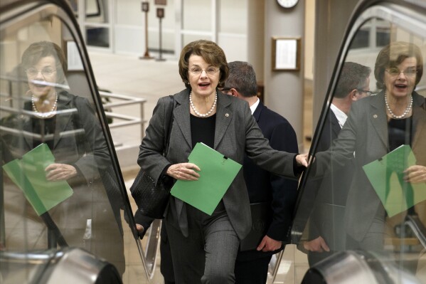 FILE - U.S. Sen. Dianne Feinstein, D-Calif., chair of the Senate Intelligence Committee, heads to the chamber to advance a bill providing $1 billion in loan guarantees to Ukraine as President Barack Obama meets with U.S. allies in Europe to punish Moscow for its annexation of the Crimean peninsula, at the Capitol in Washington, Monday, March 24, 2014. (AP Photo/J. Scott Applewhite, File)