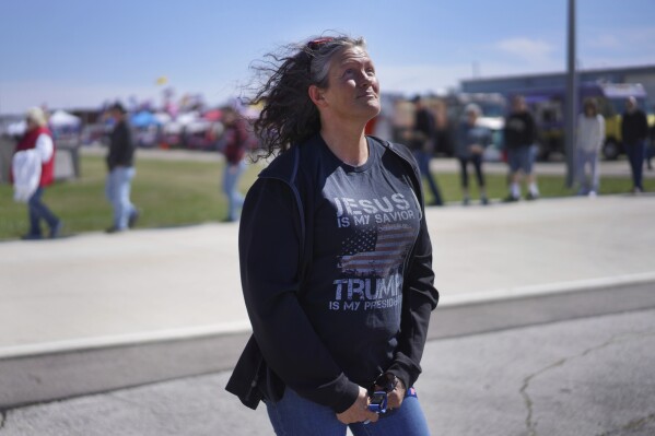 Sherrie Cotterman stands for a portrait while in line at a campaign rally for former president Donald Trump in Vandalia, Ohio, on Saturday, March 16, 2024. Trump, who is coasting to a third Republican presidential nomination, continues to draw strong support from evangelicals and other conservative Christians. (AP Photo/Jessie Wardarski)