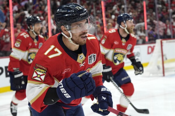 Florida Panthers center Evan Rodrigues (17) celebrates after scoring a goal against the Edmonton Oilers during the second period of Game 1 of the NHL hockey Stanley Cup Finals on Saturday, June 8, 2024, in Sunrise, Fla. (AP Photo/Wilfredo Lee)