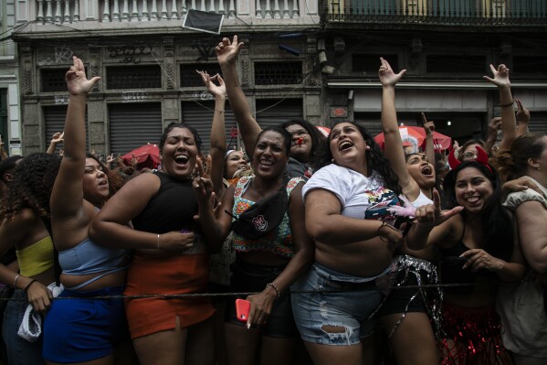 Revelers dance during a pre-carnival "Bloco da Gold" street party, in Rio de Janeiro, Brazil, Saturday, Jan. 27, 2024. (AP Photo/Bruna Prado)