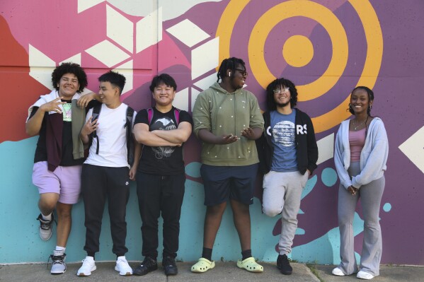 Bridge to Calculus summer program participants, from left, Steven Ramos, Kevin Dang, Kevin Tran, Peter St. Louis-Severe, Elian Martinez, and Wintana Tewolde pose for a photo on the campus of Northeastern University in Boston on Tuesday, Aug. 1, 2023. Some of the graduates of Bridge to Calculus end up enrolling at Northeastern and proceeding to its highly ranked computer science and engineering programs, which — like those at other U.S. universities — struggle to attract homegrown talent. (AP Photo/Reba Saldanha)