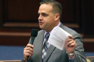 FILE - In this Wednesday, March 9, 2016, file photo, Rep. Frank Artiles, R-Miami, speaks on the red light bill during session, in Tallahassee, Fla. Prosecutors say former Sen. Artiles secretly gave more than $44,000 to a sham candidate for the Florida Legislature so that he could run as an independent in the 2020 election to confuse voters and siphon ballots from then-Democratic incumbent, Sen. Jose Javier Rodríguez. Artiles has pleaded not guilty. (AP Photo/Steve Cannon, File)