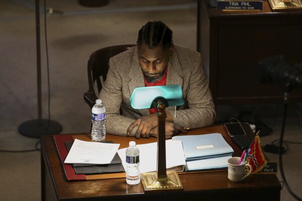 Brandon Bosley, alderman in St. Louis' 3rd ward, listens during a Board meeting at City Hall on Feb. 10, 2023 in St. Louis, Mo. The former alderman has been charged with lying to police about getting carjacked last year; the charge comes months after he was indicted by federal officials in a fraud and bribery investigation that put three other former St. Louis aldermen in prison last December. (Christian Gooden/St. Louis Post-Dispatch via AP)