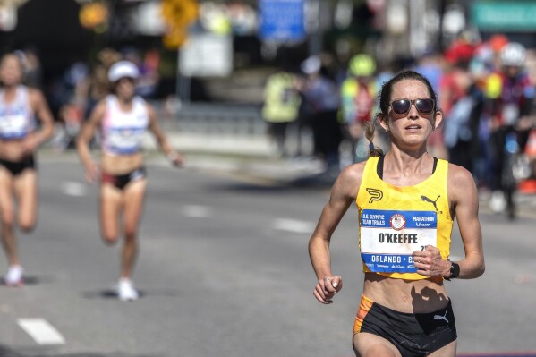Fiona O'Keeffe extends her lead during the U.S. Olympic marathon trials in Orlando, Fla., Saturday, Feb. 3, 2024. O’Keeffe finished in a time 2 hours, 22 minutes, 10 seconds to break the American marathon trials mark of 2:25:38 set by Shalane Flanagan in 2012 in Houston. (Willie J. Allen Jr./Orlando Sentinel via AP)