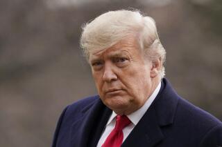 FILE - In this Dec. 31, 2020, file photo, President Donald Trump arrives on the South Lawn of the White House, in Washington. Trump's first post-White House book will be, like so much else about him, a departure from other former presidents. “Our Journey Together” is scheduled for Dec. 7, 2021, but not through a traditional New York publisher. (AP Photo/Evan Vucci, File)