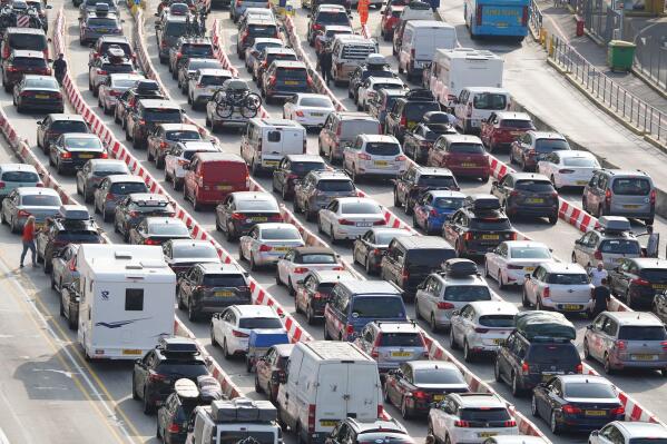Traffic queues are seen at the check-in of the Port of Dover as delays at the Port of Dover and Eurotunnel continue to affect journeys as many families embark vacations following the start of summer holidays for schools in England and Wales, near Folkestone, England,  Saturday July 23, 2022. (Gareth Fuller/PA via AP)