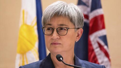 FILE - Australian Foreign Minister Penny Wong listens beside Philippine Foreign Affairs Secretary Enrique Manalo during a joint press conference at a hotel in Makati City, Philippines on Thursday May 18, 2023. An 88-year-old Australian doctor held captive in West Africa for more than seven years has been released, the Australian government said on Friday, May 19.(Lisa Marie David/Pool Photo via AP, File)