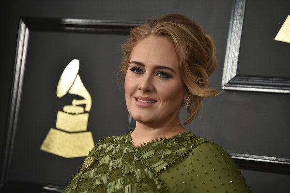
              FILE - In this Feb. 12, 2017, file photo, Adele arrives at the 59th annual Grammy Awards at the Staples Center in Los Angeles. Adele and her husband Simon Konecki have separated. The pop singer’s representatives Benny Tarantini and Carl Fysh confirmed the news Friday, April 19, 2019 in a statement to The Associated Press. The statement read: “Adele and her partner have separated. They are committed to raising their son together lovingly. As always they ask for privacy. There will be no further comment.”  (Photo by Jordan Strauss/Invision/AP, File)
            