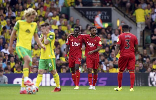 Watford's Ismaila Sarr, center left, celebrates scoring during the English Premier League soccer match between Norwich City and Watford at Carrow Road, Norwich, England, Saturday Sept. 18, 2021. (Joe Giddens/PA via AP)
