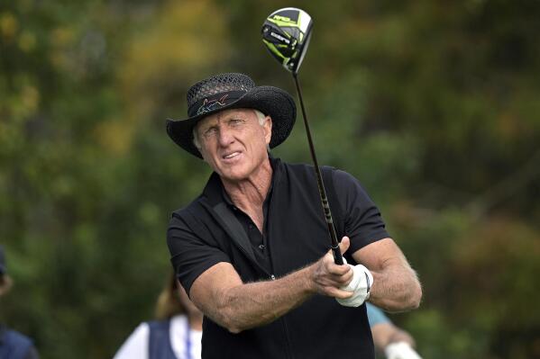 FILE - Greg Norman, of Australia, watches his tee shot on the first hole during the final round of the PNC Championship golf tournament on Dec. 20, 2020, in Orlando, Fla, USA. Norman's involvement in the Saudi Arabian-backed LIV golf tour and comments he's made about the killing of Washington Post columnist Jamal Khashoggi at a Saudi consulate in Turkey are being questioned by other Australian golfers. (AP Photo/Phelan M. Ebenhack, File)