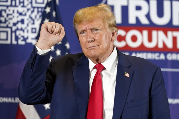 Former President Donald Trump gestures after speaking at a campaign rally at Terrace View Event Center in Sioux Center, Iowa, Friday, Jan. 5, 2024. (AP Photo/Andrew Harnik)