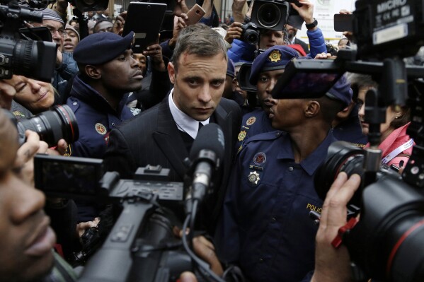 FILE - Oscar Pistorius leaves the High Court in Pretoria, South Africa, Tuesday June 14, 2016 during his trail for the murder of girlfriend Reeva Steenkamp. Pistorius was eligible for parole in March under South African law and the double-amputee Olympic runner may have been wrongly denied early release from prison then due to an error over when he began serving his murder sentence, new court documents show. Justice and correctional services authorities submitted the papers to the country's apex Constitutional Court on Tuesday, Sept. 19, 2023, saying they will not oppose an appeal by Pistorius that he has served the prescribed amount of time in jail and should be declared eligible for parole immediately. (AP Photo/Themba Hadebe, File)