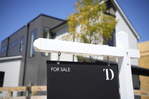 A sign stands outside a new home for sale Monday, Aug. 21, 2023, in southeast Denver. On Thursday, Freddie Mac reports on this week's average U.S. mortgage rates. (AP Photo/David Zalubowski)