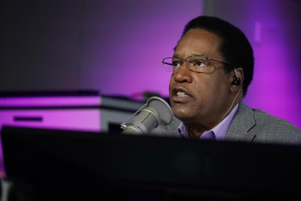 FILE — In this July 12, 2021 file photo radio talk show host Larry Elder speaks during his show, in Burbank, Calif. Alexandra Datig, Elder's former fiancee said Thursday, Aug. 19 that Elder, a candidate for governor in the Sept. 14 recall election, once displayed a gun to her during a heated argument in 2015. Elder said he never brandished a gun at anyone. (AP Photo/Marcio Jose Sanchez, File)