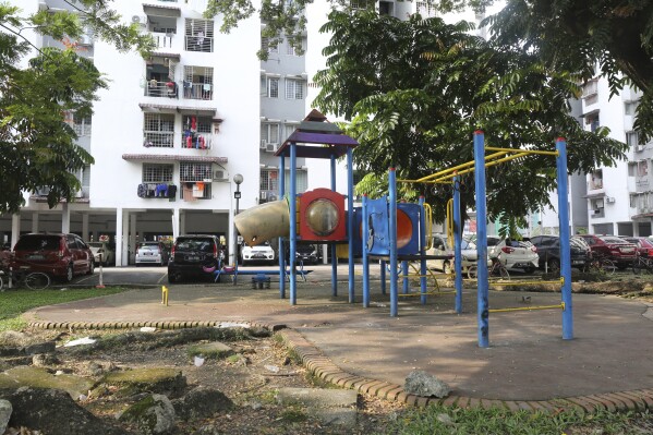 An empty playground is seen on Oct. 9, 2023, in an apartment complex where Rohingya child brides live in Kuala Lumpur, Malaysia. (AP Photo/Victoria Milko)