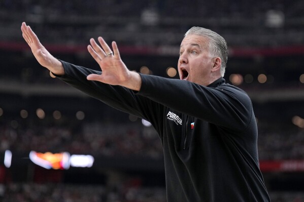 Purdue head coach Matt Painter yells during the first half of the NCAA college basketball game against NC State at the Final Four, Saturday, April 6, 2024, in Glendale, Ariz. (AP Photo/Brynn Anderson )