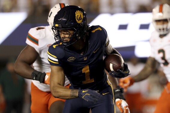 California running back Jaydn Ott (1) runs against Miami during the first half of an NCAA college football game in Berkeley, Calif., Saturday, Oct. 5, 2024. (AP Photo/Jed Jacobsohn,File)