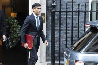 Britain's Prime Minister Rishi Sunak leaves 10 Downing Street to appear for the first time in front of the Commons Liaison Committee of select committee chairs in the House of Commons, in London, Tuesday Dec. 20, 2022. (James Manning/PA via AP)