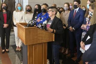 FILE - Gretchen Raffa, vice president of public policy, advocacy and organizing at Planned Parenthood of Southern New England, Inc., appears with a group of Connecticut elected officials as she speaks at a news conference on May 3, 2022, at the Connecticut State Capitol in Hartford, Conn. Connecticut state officials and abortion providers say they’re ready for the state’s first major abortion-related legislation in years. The untested law, which aims to legally protect abortion providers and patients from other states’ bans on abortion procedures, takes effect on Friday, July 1, 2022. (AP Photo/Susan Haigh, File)