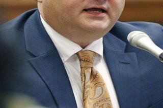 FILE - John Davis, then executive director of the Mississippi Department of Human Services, answers lawmakers' questions at the state Capitol in Jackson, Miss., on Sept. 7, 2016. Davis pleaded not guilty, in April 2022, to charges of bribery, conspiracy and making false statements to the government about alleged misspending of federal money that was intended to help poor people. (AP Photo/Rogelio V. Solis, File)