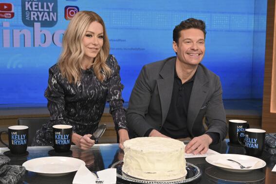 This image released by ABC shows co-host Kelly Ripa, left, and Ryan Seacrest on the set of "Live! With Kelly and Ryan" on Feb. 8, 2023 in New York. Seacrest has revealed he’s leaving the show this spring. Seacrest ends a six-year run alongside Ripa and his replacement will be her real-life husband, Mark Consuelos. (Lorenzo Bevilaqua/ABC via AP)