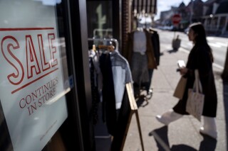 FILE - A shop holds a sidewalk sale on Feb. 10, 2023, in Providence, R.I. Inflation remains a top concern for small businesses, which reported lower optimism in February. (AP Photo/David Goldman, File)