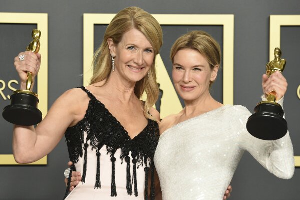 Laura Dern, winner of the award for best performance by an actress in a supporting role for "Marriage Story", left, and Renee Zellweger, winner of the award for best performance by an actress in a leading role for "Judy", pose in the press room at the Oscars on Sunday, Feb. 9, 2020, at the Dolby Theatre in Los Angeles. (Photo by Jordan Strauss/Invision/AP)