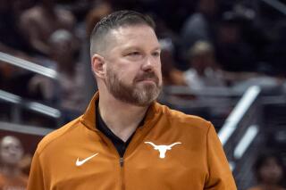 FILE - Texas head coach Chris Beard looks on during the first half an NCAA college basketball game against UTEP on Nov. 7, 2022, in Austin, Texas. Travis County District Attorney Jose Garza on Wednesday, Feb. 15, 2023, moved to dismiss a felony domestic violence case against former Texas basketball coach Chris Beard, in part because of alleged victim's wishes not to prosecute. (AP Photo/Michael Thomas, FIle)