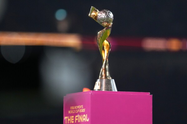 FILE - The tournament trophy is displayed on the pitch before the Women's World Cup soccer final between Spain and England at Stadium Australia in Sydney, Australia, on Aug. 20, 2023. Brazil's bid for the 2027 Women's World Cup was ranked higher than the bid submitted by Germany, the Netherlands and Belgium in an evaluation report released by FIFA on Tuesday, May 7, 2024. (Ǻ Photo/Abbie Parr, File)