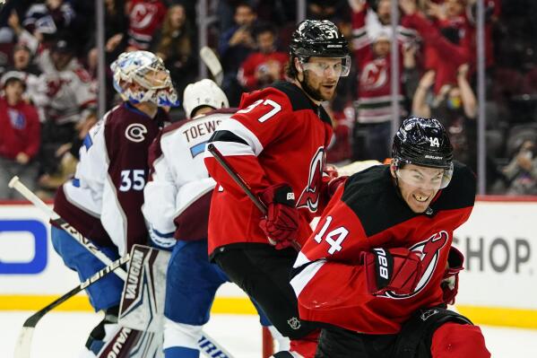 New Jersey Devils' Nathan Bastian (14) celebrates after scoring a goal during the third period of an NHL hockey game against the New Jersey Devils Tuesday, March 8, 2022, in Newark, N.J. The Devils won 5-3. (AP Photo/Frank Franklin II)