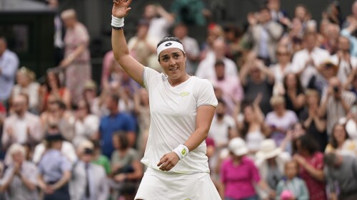 Tunisia's Ons Jabeur celebrates beating Aryna Sabalenka of Belarus to win their women's singles semifinal match on day eleven of the Wimbledon tennis championships in London, Thursday, July 13, 2023. (AP Photo/Alberto Pezzali)